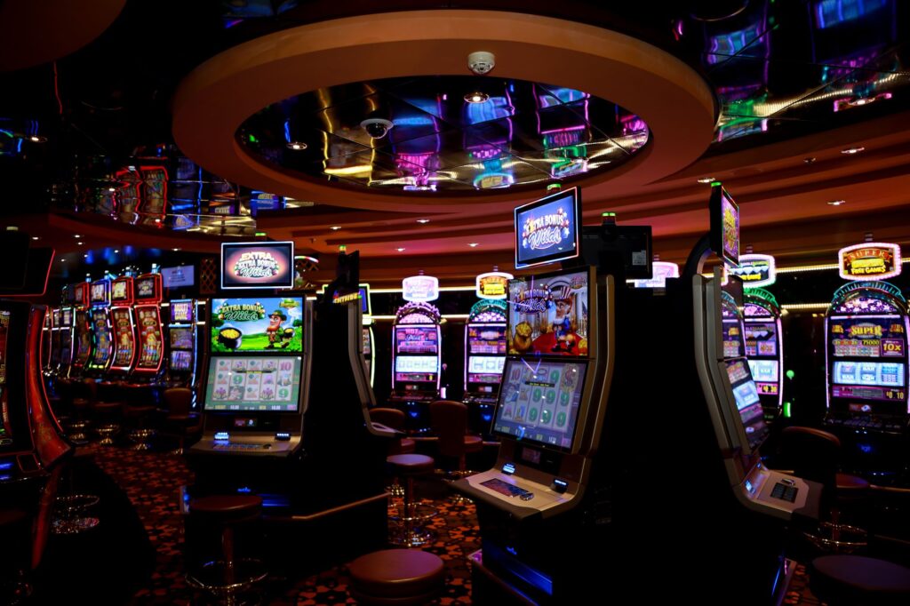 Close-up of illuminated slot machine reels in dim light